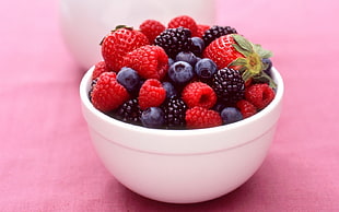 assorted berries in round white bowl